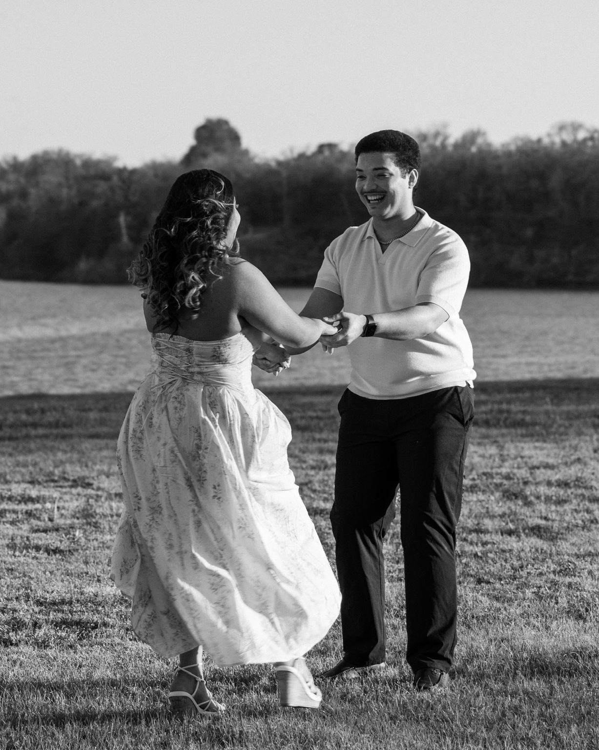 A couple laughing together at golden hour in North Texas
