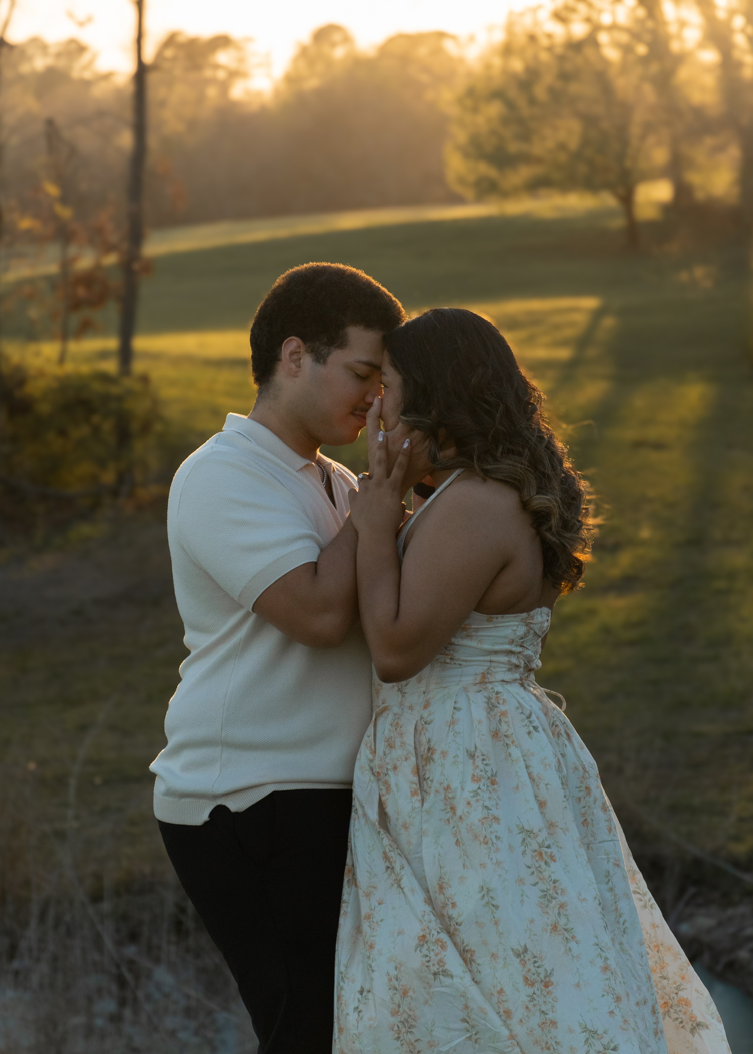 A couple sharing a close moment in warm evening light